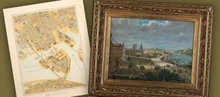 Dekorativt montage med karta och målning i guldram
