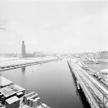 Arbete med Norra Järnvägsbron och Centralbron. T.v. går en provisorisk pontonbro mellan Klara Mälarstrand och Riddarholmen