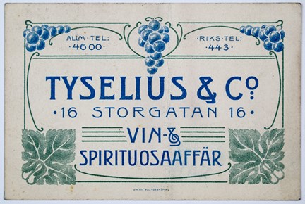 Reklamkort tryckt i blått och grönt med bild av vinrankor samt text.