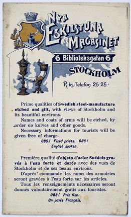 Reklamtryck i blått och guld med bild på metallföremål samt text.